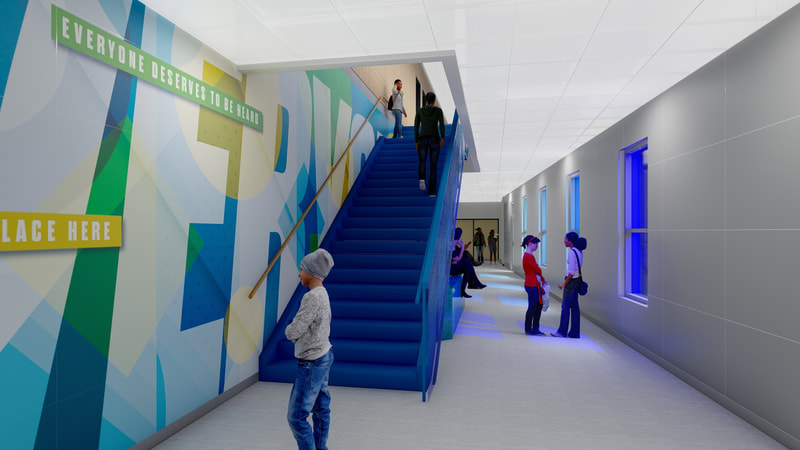 Jacquet Middle School, Blue stairway with students in hall. Wall graphics are blue, green, and yellow and read "Everyone" in large white lettering. Quotes read "Everyone is welcome" 